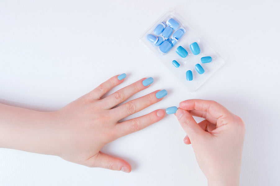 How do I apply false nails?